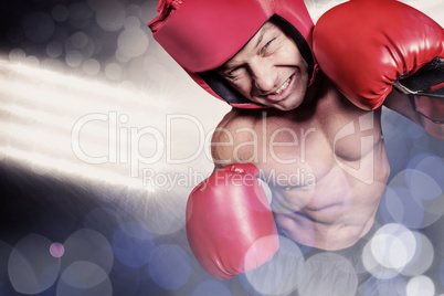 Composite image of high angle view of boxer with headgear and gl