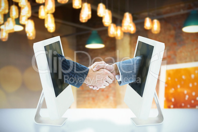 Composite image of business people shaking hands