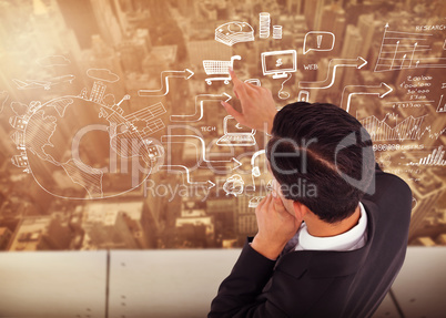 Composite image of thoughtful asian businessman pointing