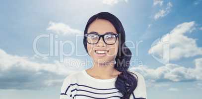 Composite image of smiling asian woman with arms crossed looking