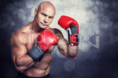 Composite image of portrait of boxer with red gloves