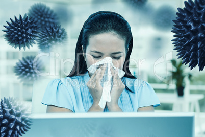 Composite image of businesswoman blowing her nose
