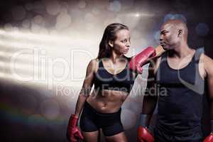 Composite image of male and female boxer looking at each other