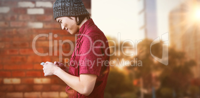 Composite image of smiling hipster businessman using phone