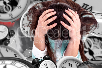 Composite image of worried businesswoman holding her head