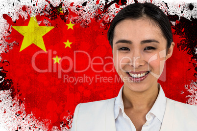 Composite image of smiling businesswoman looking at the camera