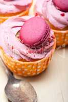 pink berry cream cupcake with macaroon on top