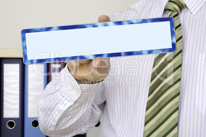 Businessman holding blank sign Businessman holding blank sign