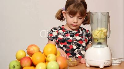 little girl make juice