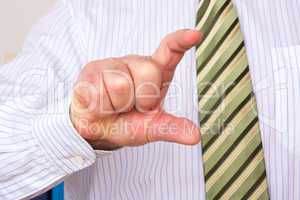 Man pointing finger size to