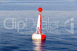 red white moored buoy in blue sea