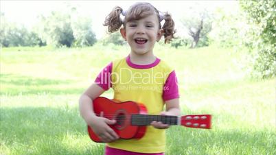 little girl play guitar