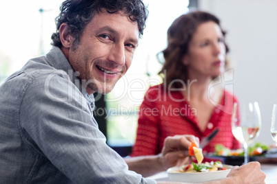 Portrait of man having lunch with his friends