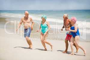 Seniors running at the beach
