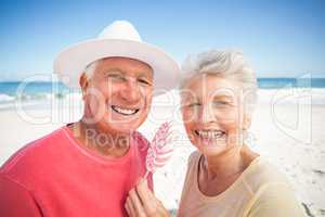 Senior couple eating lollipop