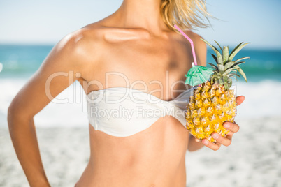 Woman holding a pineapple