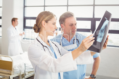 Doctors examining an x-ray report