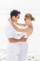 Romantic couple embracing on the beach