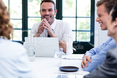 Businessman smiling in a business meeting