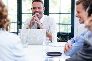 Businessman smiling in a business meeting