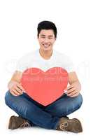 Young man holding heart shap