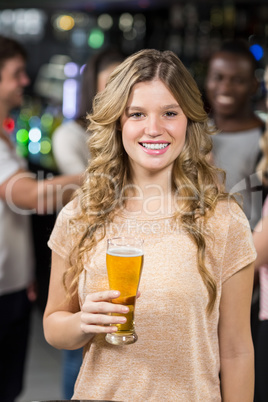 Smiling friends having beers