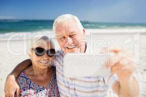 Senior couple taking selfie