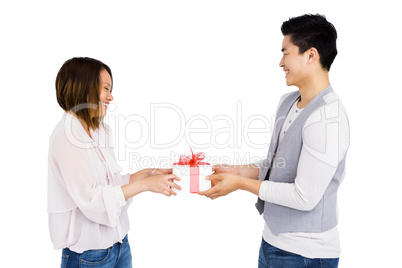 Young man giving a present to woman