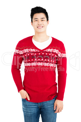 Happy man in red pullover smiling at camera