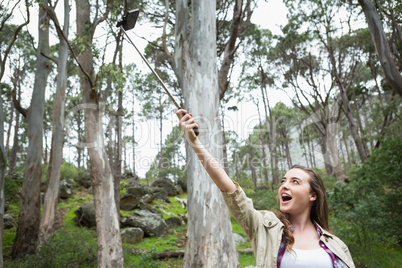 Smiling woman taking selfies