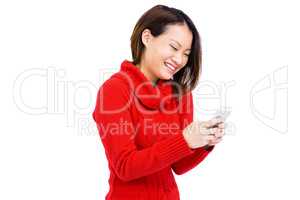 Confident young woman using mobile phone