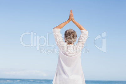 Casual senior woman with arms outstretched