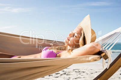 Woman lying in hammock