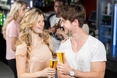 Friends toasting with beer