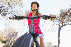 Smiling woman cycling