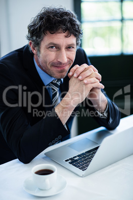 Portrait of businessman smiling in restaurant Portrait of businessman smiling in restaurant