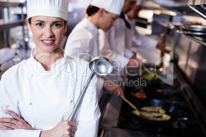 Portrait of chef holding a ladle