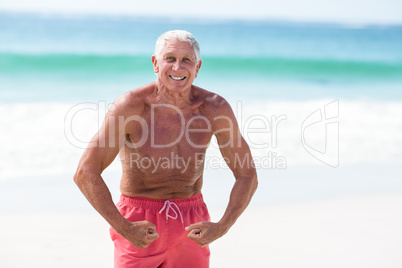 Handsome mature man showing his muscles