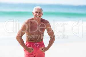 Handsome mature man showing his muscles
