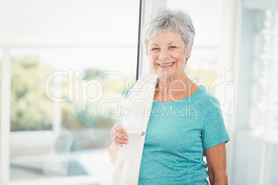 Portrait of smiling woman with towel