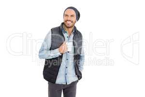 Happy young man holding coffee mug