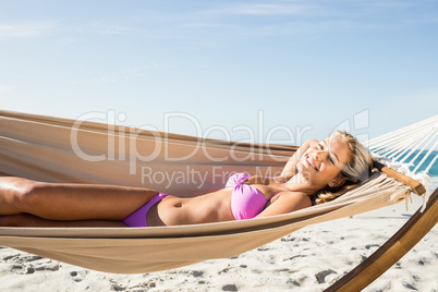 Woman lying in hammock