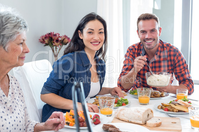 Happy family having breakfast