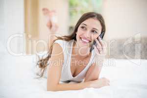 Smiling woman talking on mobile phone