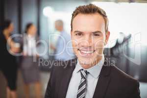 Portrait businessman smiling at camera