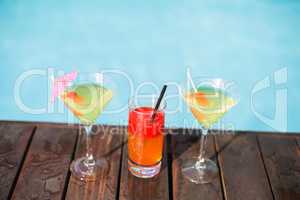 Cocktail glasses on wooden deck