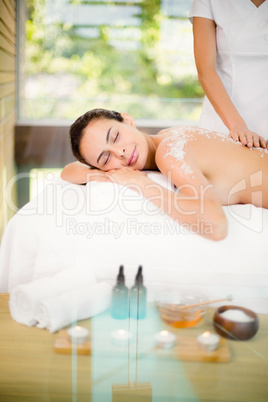 Young woman enjoying spa treatment