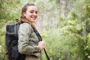 Smiling woman with backpack