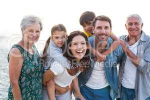 Happy family posing at the beach