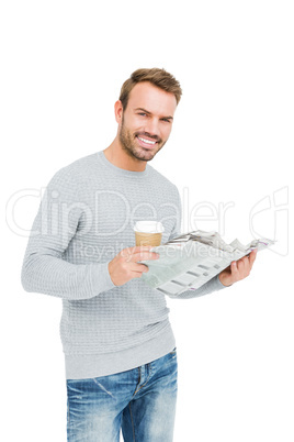 Young man holding disposable cup